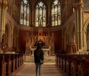 person in church looking up