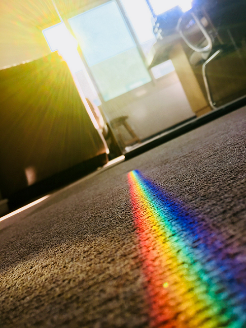 photo of rainbow coming through window