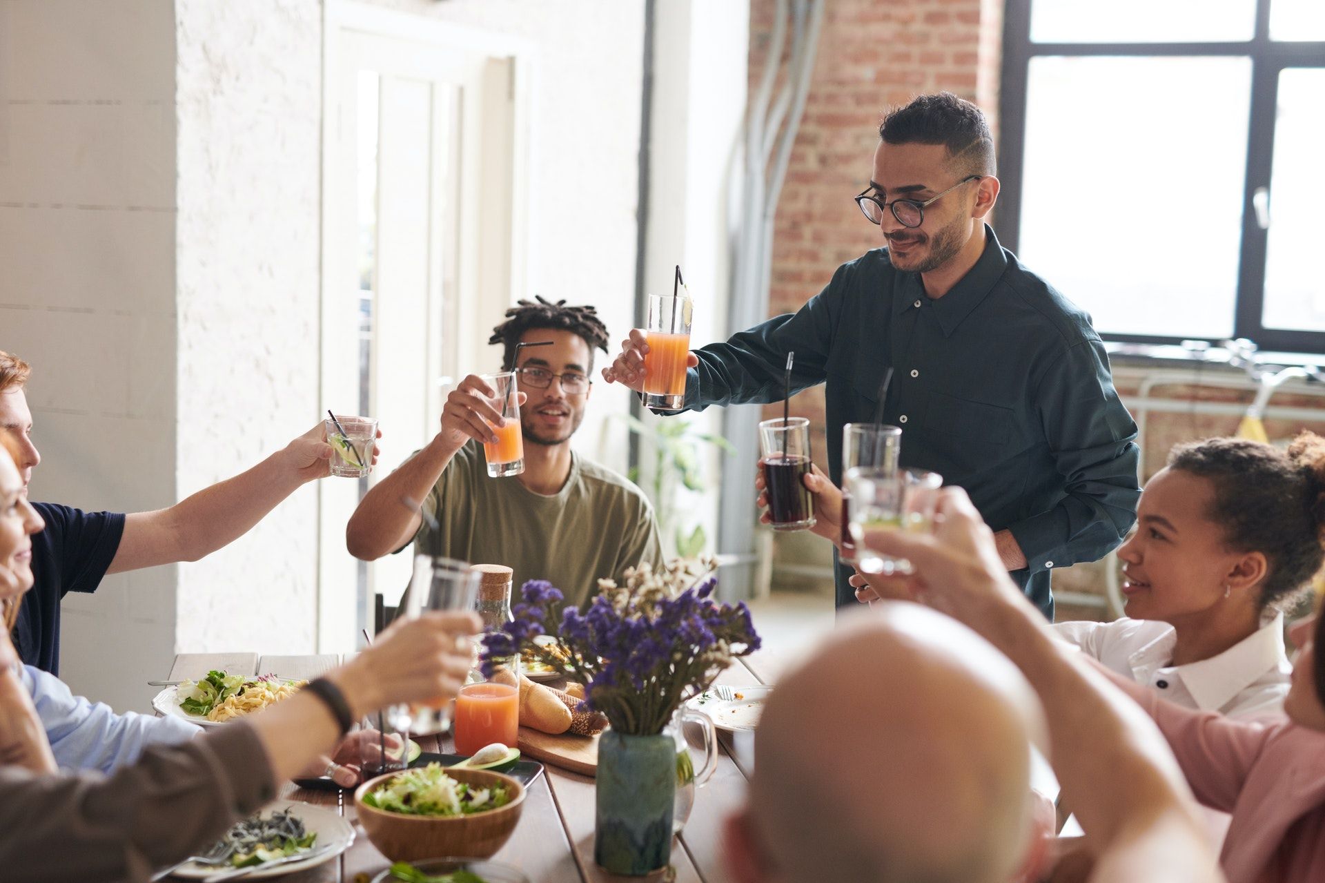 picture of people toasting drinks