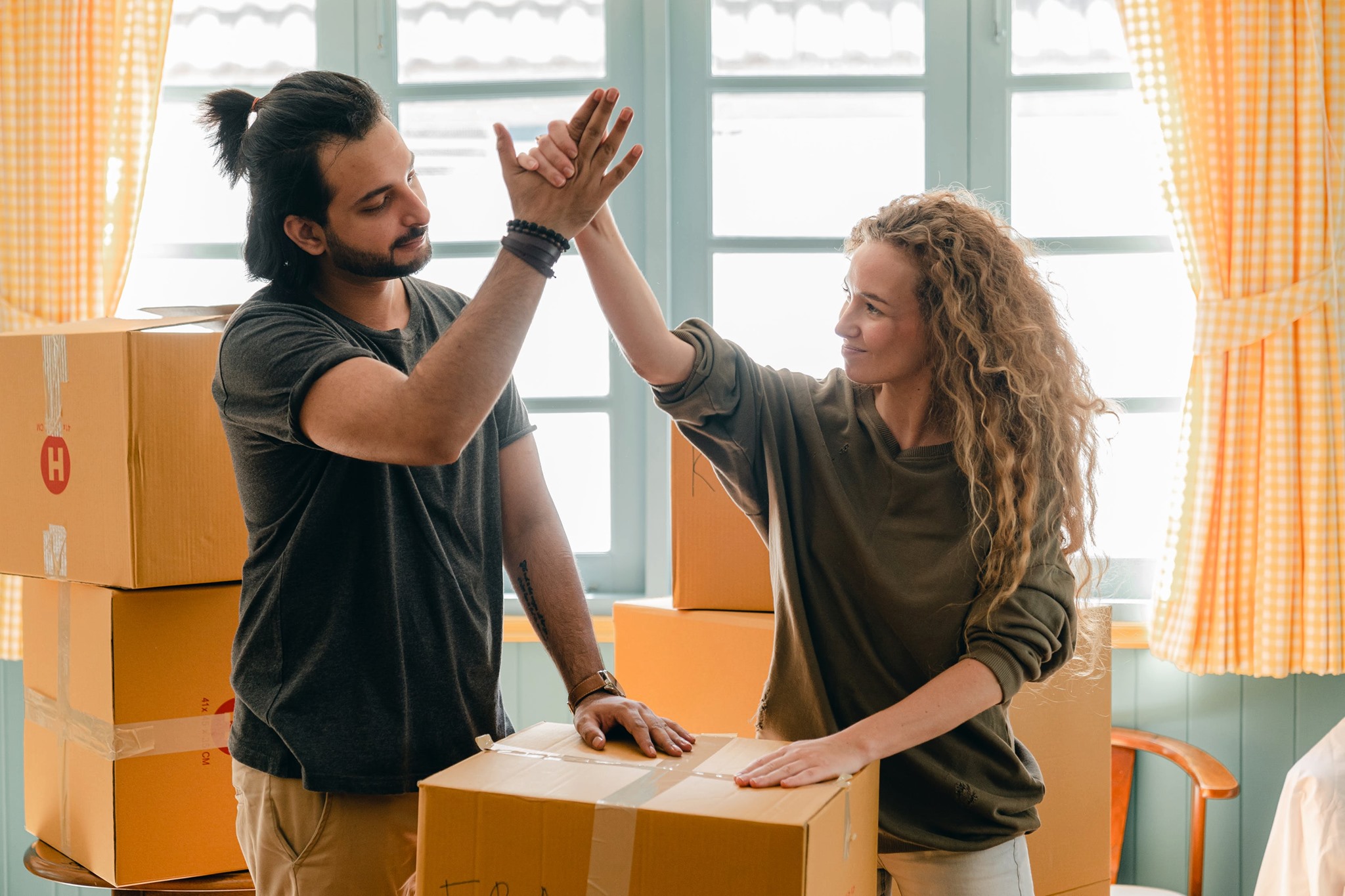 photo of two people high fiving