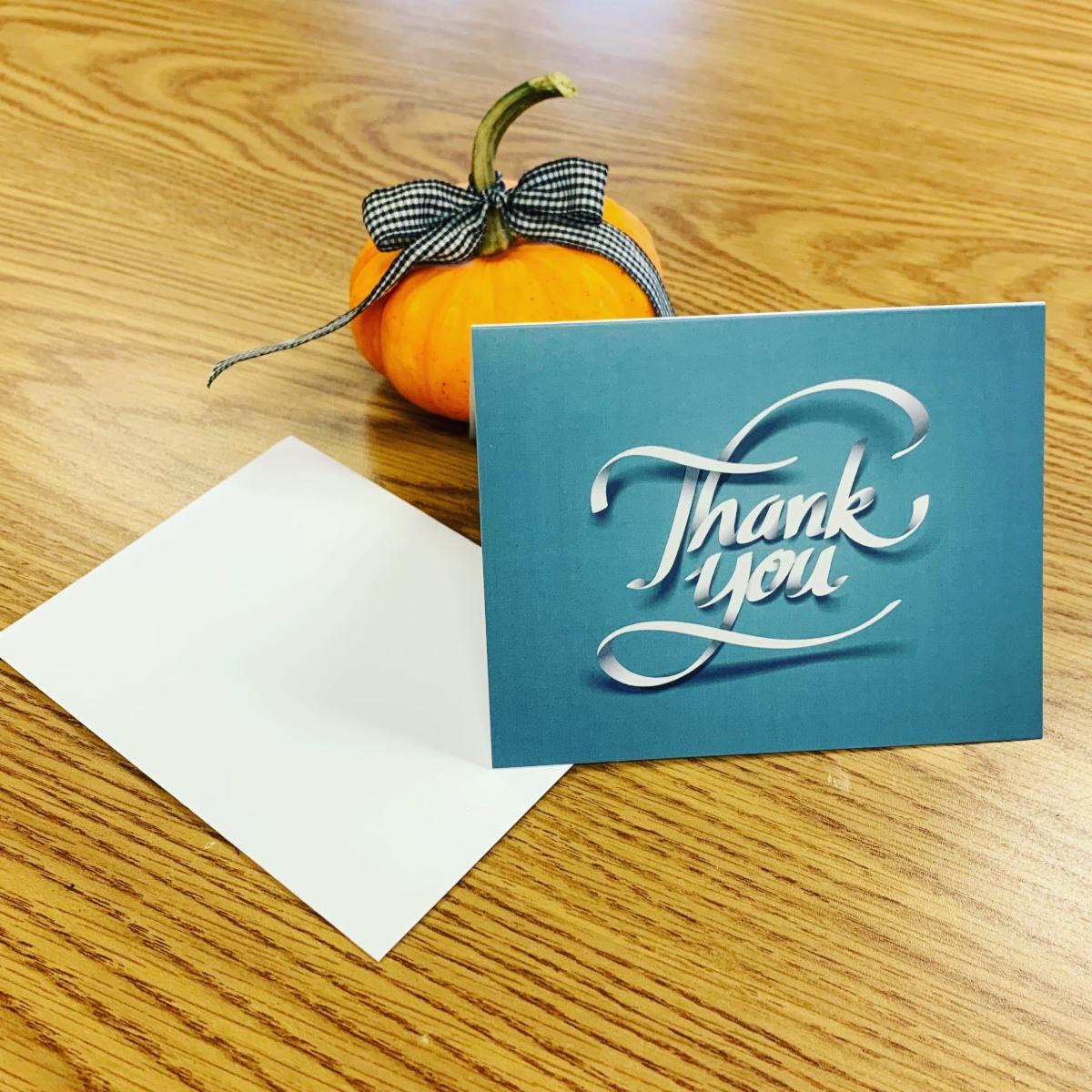 photo of small pumpkin and thank you card